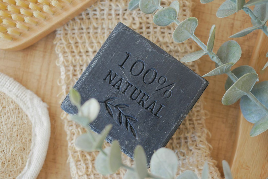 Handmade charcoal soap bar on wooden table